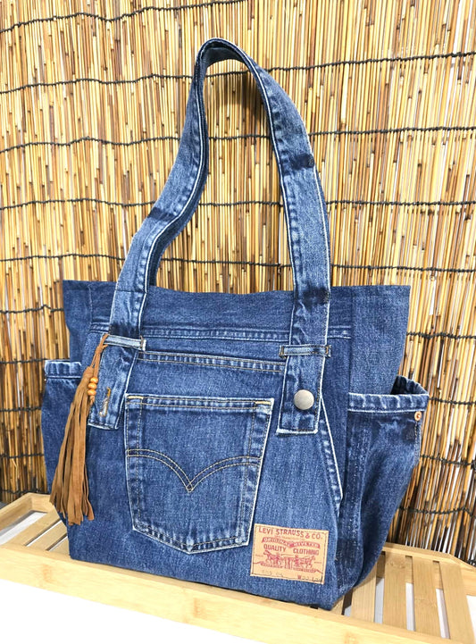 Handmade denim bag with floral lining, unique artisan patchwork tote, sustainable blue jean shopper. label.